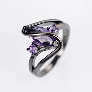 Fashionable gun black ring featuring a marquise cut purple zircon in a streamlined design