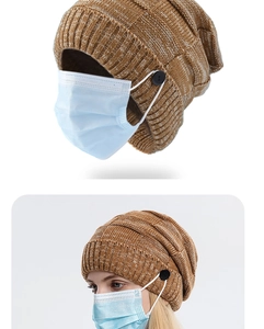 Close-up of caramel knit beanie showing thick cable pattern and button for mask straps