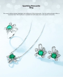 S925 silver jewelry set featuring emerald-cut green gems in a bow-knot diamond design