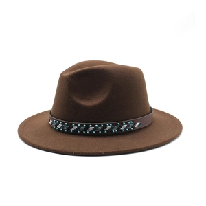 Detail of dark brown wool fedora hat featuring a colorful ethnic beaded headband decoration