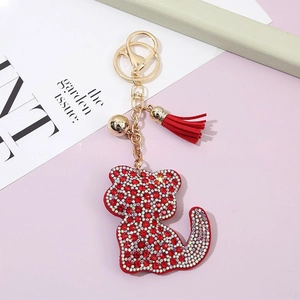 Cute red and white crystal cat keychain with a leather tassel and gold metal lobster clasp