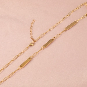 Gold layered paperclip chain necklace with a sleek rectangular vertical bar pendant