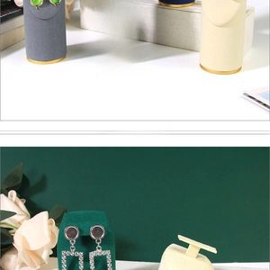 Macro detail of velvet solid wood jewelry display stands in various elegant colors