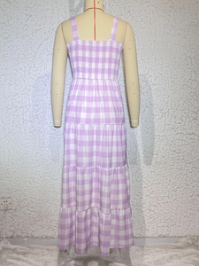 Detail of purple gingham tiered maxi dress showing smocked back and elastic texture