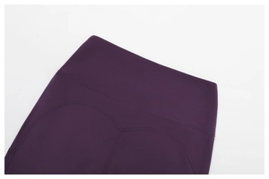 Detail of high-waist heart-shaped stitching on dark purple yoga leggings for butt lifting