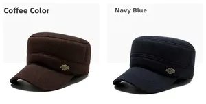 Detail showing textured twill fabric and metal shield badge on brown and navy flat caps