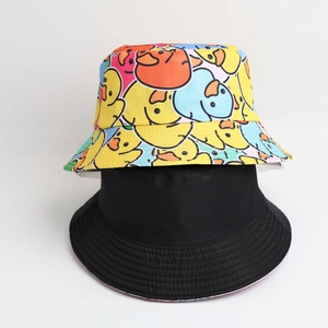 Reversible bucket hat with colorful cartoon duck print and solid black side for sun protection