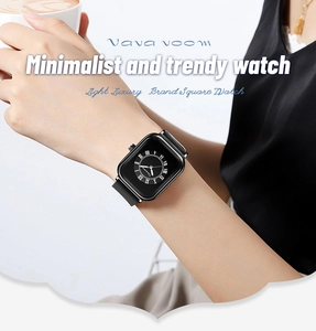 Close-up of a stylish square black quartz watch on a female model wrist with minimalist design
