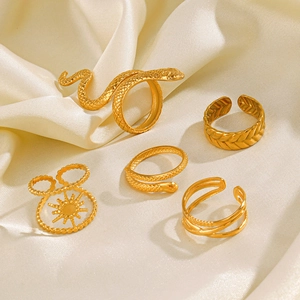 Golden stainless steel snake ring set with textured wheat pattern and sunburst design
