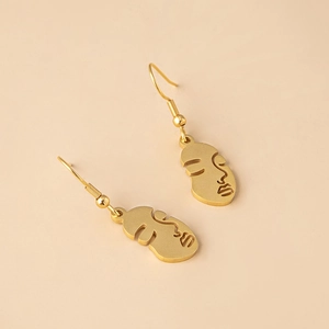 Modern abstract face earrings in gold finish with a minimalist cutout line art design