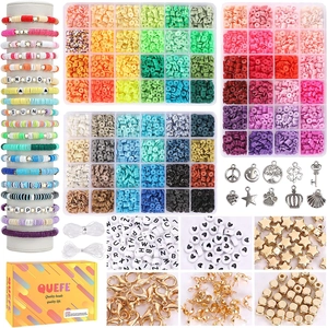 Flat lay of DIY jewelry kit with colorful clay beads, charms, and elastic cord set