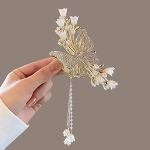 Elegant butterfly hair claw clip with lily of the valley and long pearl tassels
