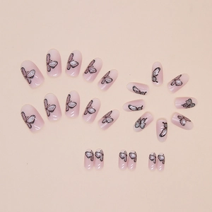 Nude pink cat-eye press-on nails with butterfly patterns in a 24-piece oval set