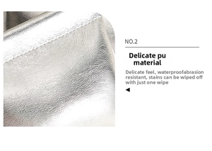 Makroaufnahme von silbernem strukturiertem PU-Leder mit wasserdichten Materialdetails