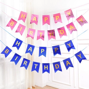 Close-up of pink and blue HAPPY BIRTHDAY banners with gold foil lettering for parties