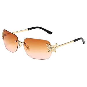 Retro rimless butterfly square sunglasses with gradient orange lenses and rhinestone details