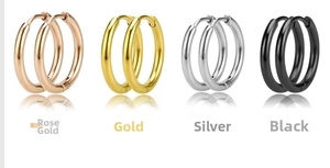 Detail showing four pairs of minimalist stainless steel hoop earrings in rose gold and black