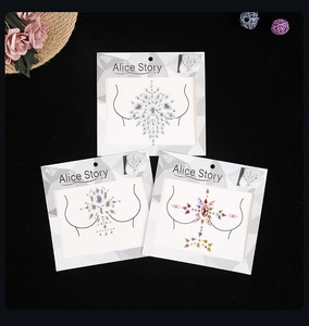 Close-up of sparkling resin acrylic crystal breast stickers for festive body decoration