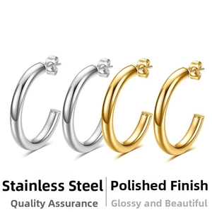 Detailed view of polished stainless steel C-shaped hoop earrings in gold and silver