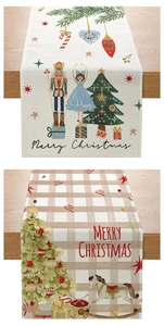 Detail of Christmas table runners with nutcracker and rocking horse prints on wood texture