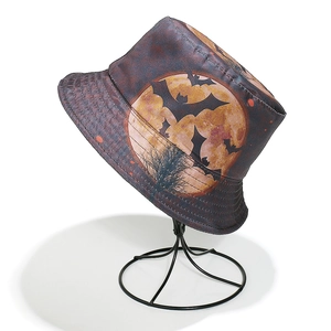 Detailed pattern of bats and orange full moon on a Halloween themed bucket hat
