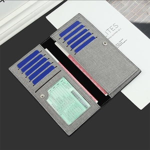Detail view of grey long wallet interior with 11 card slots and transparent ID window