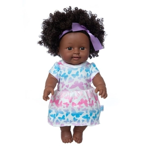 Detail of 12-inch African baby doll with curly hair and butterfly pattern dress