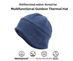 Detail of high-density navy fleece hat showing windproof and thermal fabric texture