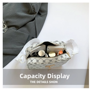 Detailed internal view of small white crossbody bag showing spacious daily capacity