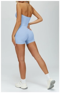 Detail of cross-back yoga top and high-waisted shorts with scrunch butt lifting effect