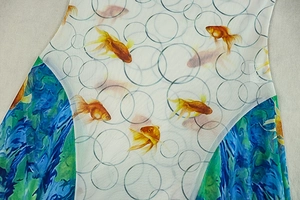 Detailed view of goldfish print and wave patterns on lightweight mesh dress fabric