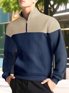 Detail of men's quarter-zip waffle sweatshirt with quilted diamond pattern and contrast collar