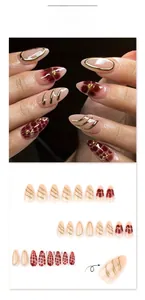 Macro detail of JP3871 press-on nails with 3D gold wire and burgundy floral art
