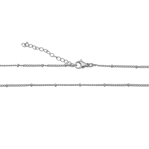 Close-up of silver adjustable necklace chain with bead accents and lobster clasp
