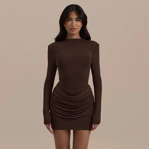 Detail of deep brown bodycon dress showing elegant ruching design and slim fit fabric