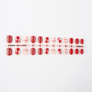 Close-up of 24pcs short square press-on nails with red apple, glitter, and plaid designs
