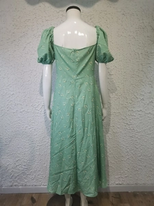 Detail of floral puff sleeve dress back with square neckline and fitted waist cut