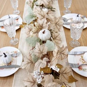 Detailed Thanksgiving table runner with white pumpkins, maple leaves and white berries