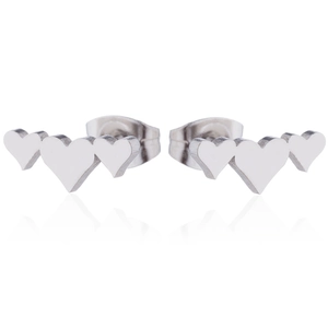 Close-up of silver triple heart stud earrings with polished mirror finish and reflections