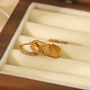18K gold plated stainless steel huggie earrings featuring sparkling cubic zirconia stones