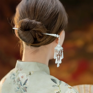 Handcrafted silver Hmong hair pin with delicate tassels and ethnic retro style