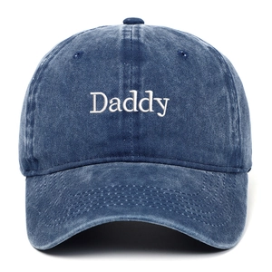 Navy blue washed denim baseball cap with white Daddy embroidery and adjustable strap