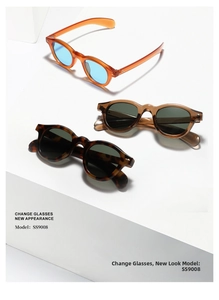 Detailed view of three vintage round sunglasses with colored frames and tinted lenses