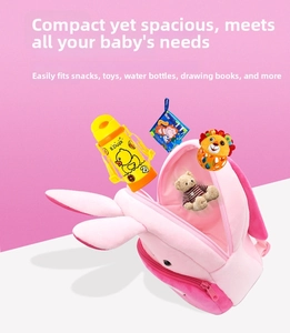 Pink plush bunny backpack for toddlers showing internal storage for water bottle and books