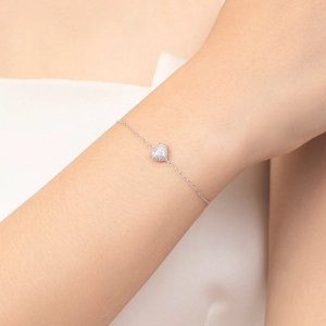 Elegant S925 sterling silver chain bracelet with micro-pave heart charm on wrist