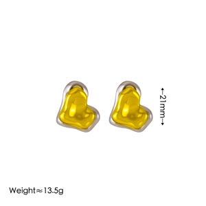 Two-tone gold and silver heart-shaped stainless steel earrings measuring 21mm in diameter