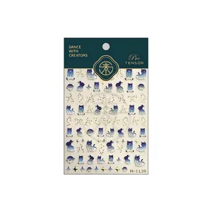 Starry sky cartoon nail stickers featuring blue cats, rabbits and gold constellation patterns
