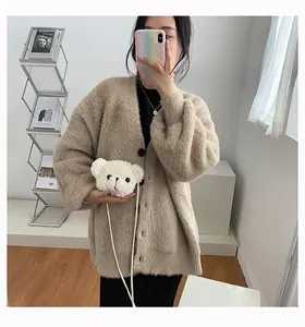 Close-up of a cute white plush bear-shaped crossbody bag with a slim strap for women
