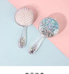 Detail of glitter-filled pink and blue hairbrushes with round-tip massage bristles