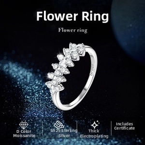 Close-up of S925 sterling silver flower ring featuring D color moissanite stones